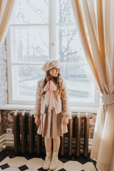 Pleated golden-rose tweed skirt.