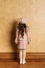 Pleated golden-rose tweed skirt.