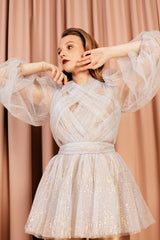 Glamorous glittery sheer blouse made of misty white tulle and lined with 100 % silk.