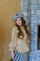 Exquisite swan blue velvet beret with golden quilting.