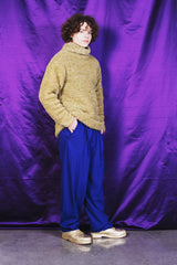 Hand-knitted textured sweater in shimmering golden shade with the softest silk lining for comfort.