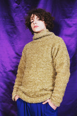 Hand-knitted textured sweater in shimmering golden shade with the softest silk lining for comfort.