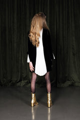 Midnight black mini dress with silk inset and pleated back.