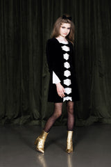 Midnight black mini dress with silk inset and pleated back.