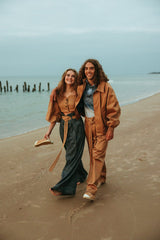 Elegant silk polo shirt with hidden front button closures and a spread collar.