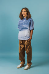 Elegant silk polo shirt with hidden front button closures and a spread collar.