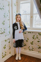 White chiffon asymmetric blouse with pleated collar.