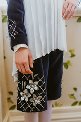 White chiffon asymmetric blouse with pleated collar.