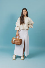 Exquisite wicker tote bag with a double handle and linen inner bag that has a cotton lining express refined charm.