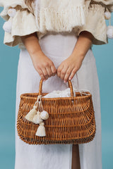 Exquisite wicker tote bag with a double handle and linen inner bag that has a cotton lining express refined charm.