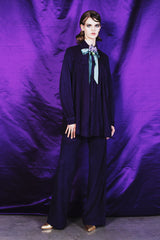 Wide leg deep purple suede trousers with a 100 % silk lining.