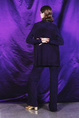 Wide leg deep purple suede trousers with a 100 % silk lining.