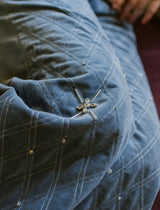 Swan blue velvet wide trousers, with crossed silver thread stitching.