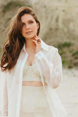 Linen and silk corset top with a cross-back neckline.