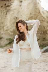 Linen and silk corset top with a cross-back neckline.