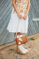 Exquisite wicker handbag with a double handle and linen inner bag that has a cotton lining expresses refined charm.