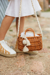 Exquisite wicker handbag with a double handle and linen inner bag that has a cotton lining expresses refined charm.