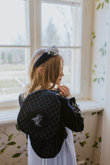 Dark night blue quilted headband with embellished crystals and silver flowers.