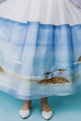 Stunning silk taffeta and organza full-skirt midi dress with a hand-painted sea landscape and hand-embroidered seagulls.