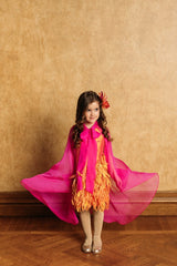 Playful sunset color taffeta dress.