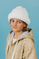 Bold, handcrafted, pearl white beanie hat, made in a ribbed knitting pattern.