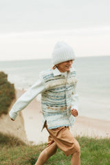 Bold, handcrafted, pearl white beanie hat, made in a ribbed knitting pattern.