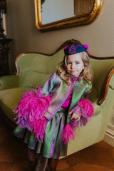 Magical chameleon jacket with magnificent fuchsia feathers along bottom and cuffs.