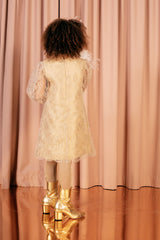 Beige knee-length A line lace dress with sheer bishop sleeves and a soft 100 % silk lining.