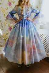 The Magical Sunrise dress is a true collector’s item, completely hand-painted silk by Aristocrat Kids founder and creative director Dace Samite