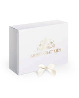 The Magical Sunrise dress is a true collector’s item, completely hand-painted silk by Aristocrat Kids founder and creative director Dace Samite