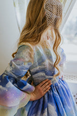 The Magical Sunrise dress is a true collector’s item, completely hand-painted silk by Aristocrat Kids founder and creative director Dace Samite