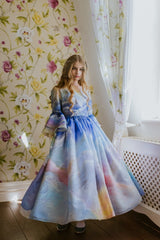 The Magical Sunrise dress is a true collector’s item, completely hand-painted silk by Aristocrat Kids founder and creative director Dace Samite