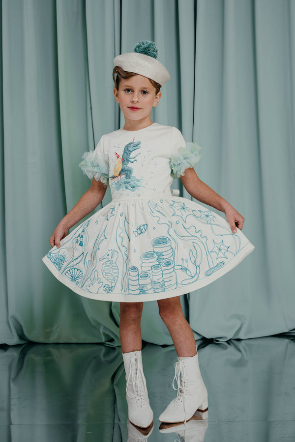  couture for kids hand-painted and embroidered cotton statement dress with silk lining. Interactive design: comes with textile markers for creative and individual colouring. 