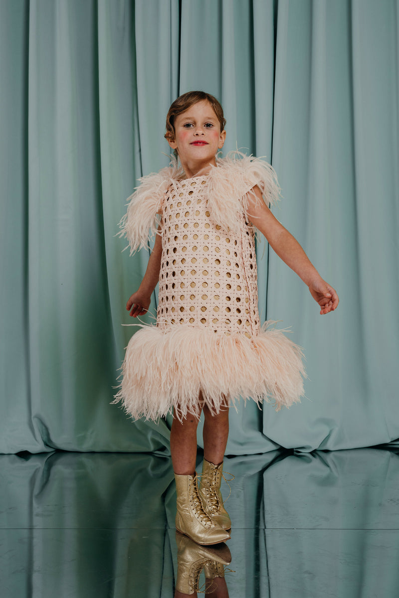 Gorgeous hand-braided dress in a soft creamy peach shade adorned with the softest natural ostrich feathers and embroidered with crystals Luxury clothing for girls