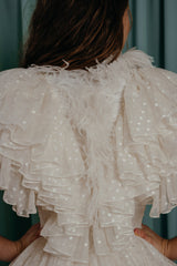 kids clothing for occasions Romantic ruffled top with magnificent texture and natural ostrich feather trim. 