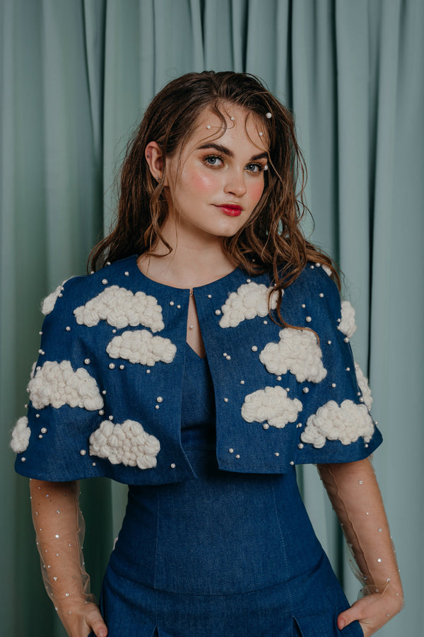 couture for kids Irresistibly playful mid-arm length cape in deep blue denim with fluffy hand-embroidered yarn clouds, embellished with crystal pearls