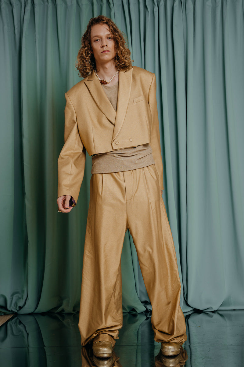 Oversized baggy fit skater type pants in soft gold. Extra long. Pockets on the sides and in the back. A perfect match for the cropped soft gold jacket.