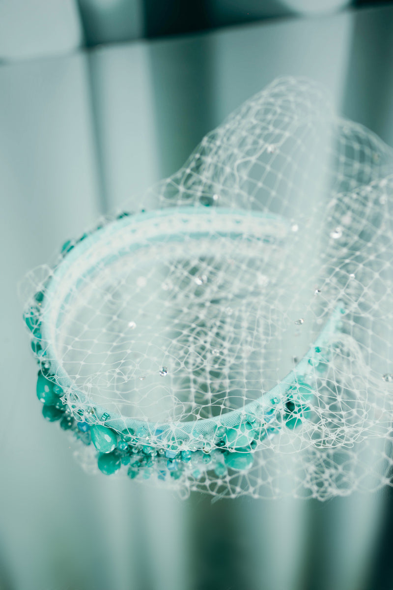 mist of the sea headband features a delicate netting embellished with exquisite glass beads, pearls, and crystals,