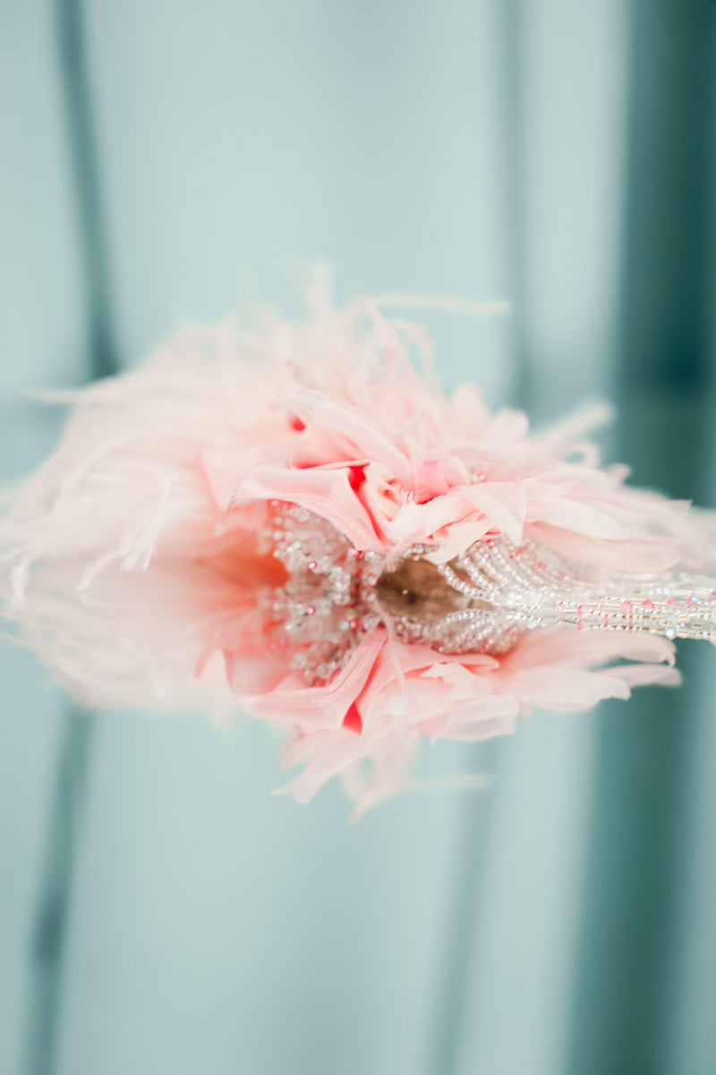 couture for kids silk flower hair clips, each one featuring plush ostrich feathers and delicate strands of glass beads