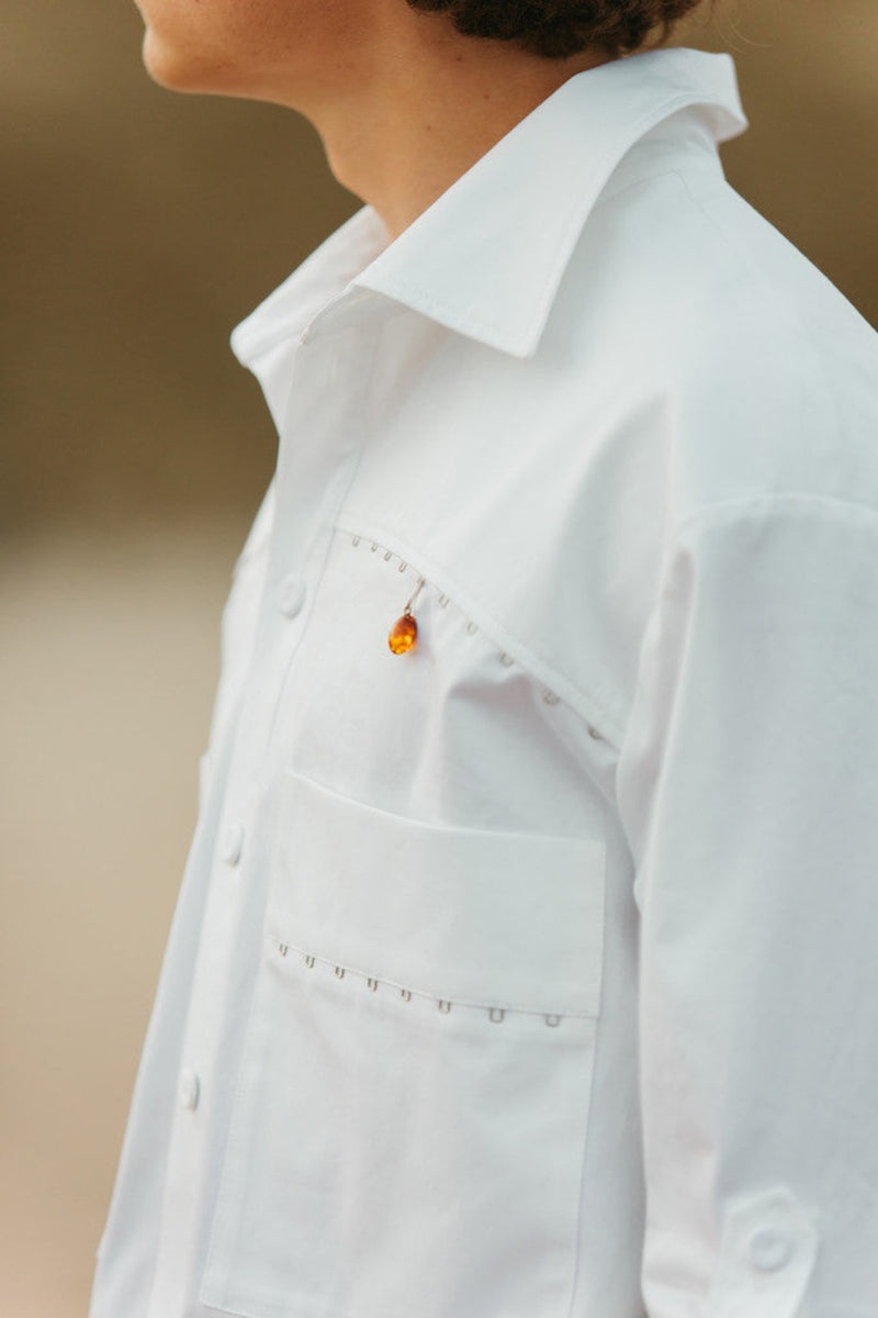 Amber piercings can be attached to RIVIERA collection shirts and other garments as much as you wish.