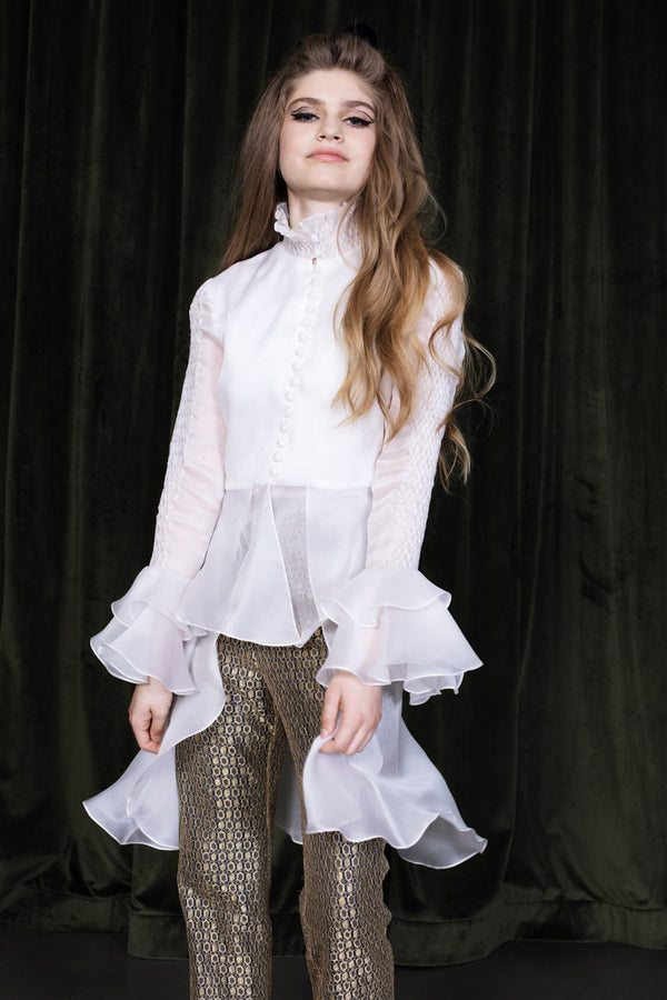 Flounced misty white blouse with diamond-smocked collar and sleeve trim in flowing silk organza.