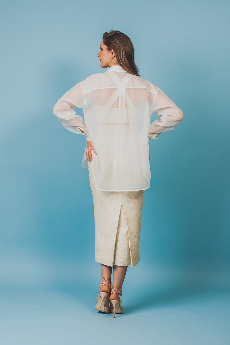 Gracious soft white, transparent organza blouse without buttons.