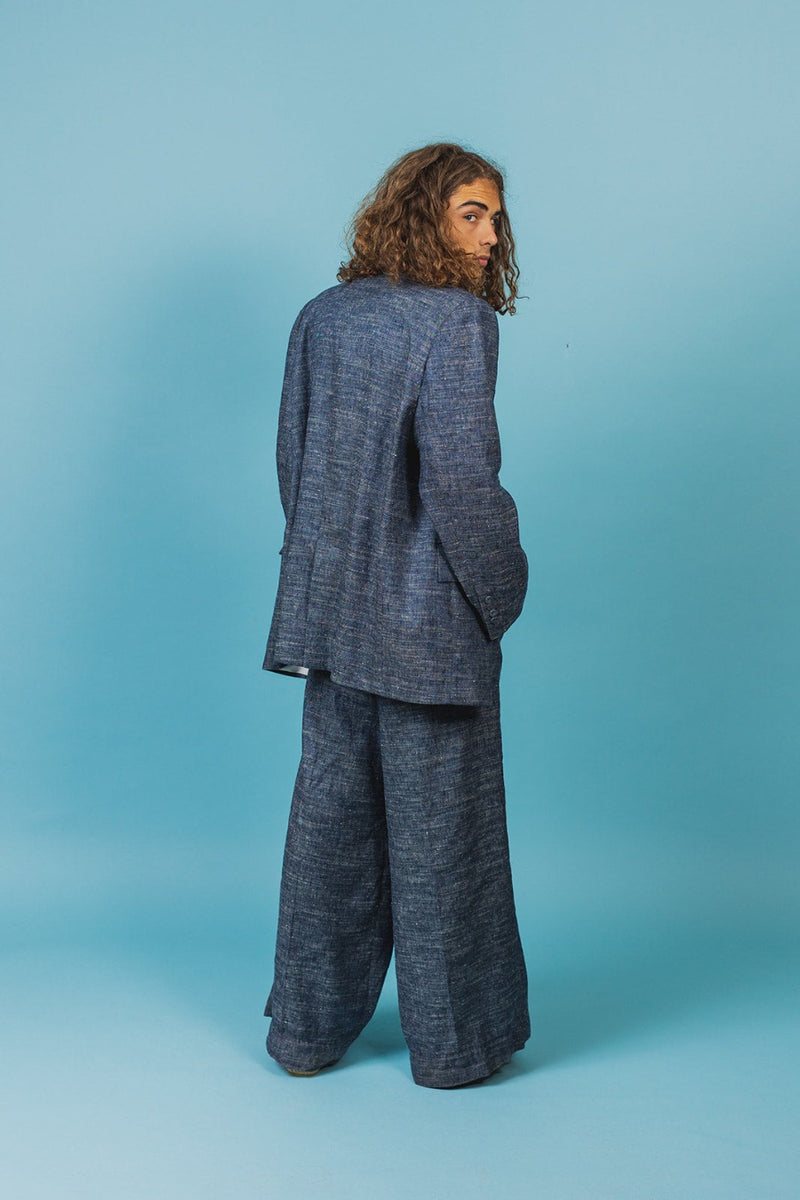 Elegantly tailored oversized suit jacket made of indigo blue silk linen.