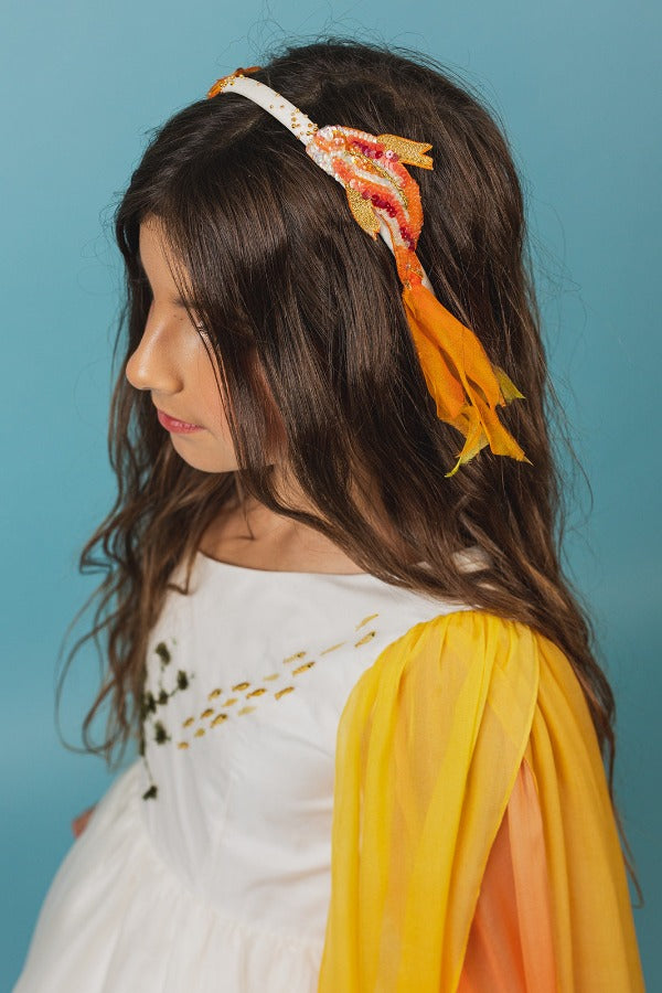 Silk headband with hand-embroidered goldfish made of crystals, beads, and silk details.
