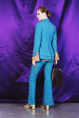 Sky blue elegant boot cut trousers with ornate details at the bottom.