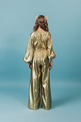Charming golden silk jumpsuit with a deep V-neck and strings for closure at neckline.
