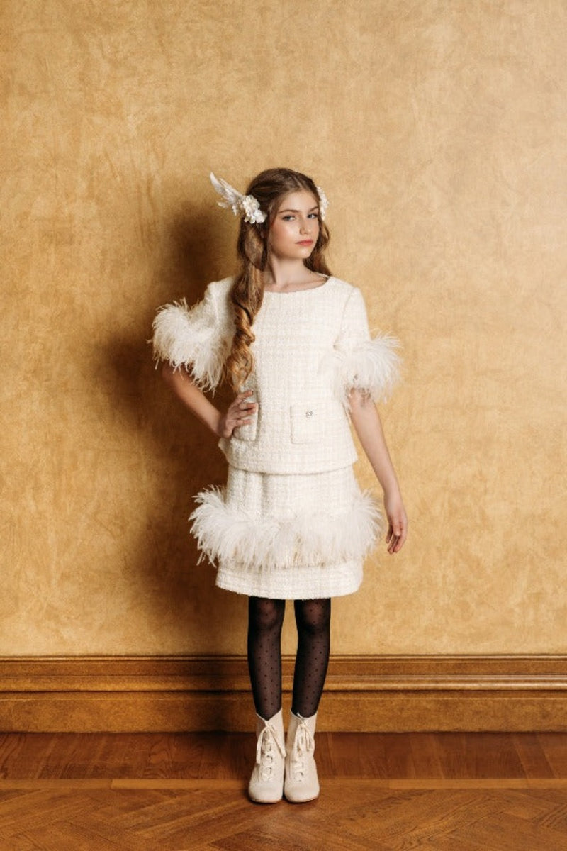 Creamy-white tweed top with 3/4 length sleeves decorated with white swan feathers and fringe.