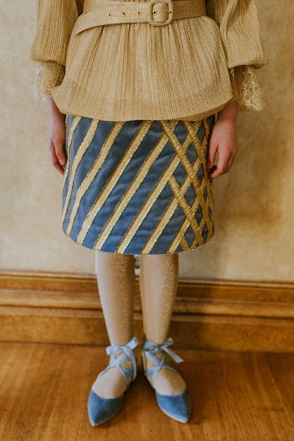 Royal velvet midi skirt with crossed golden ribbon stitching.