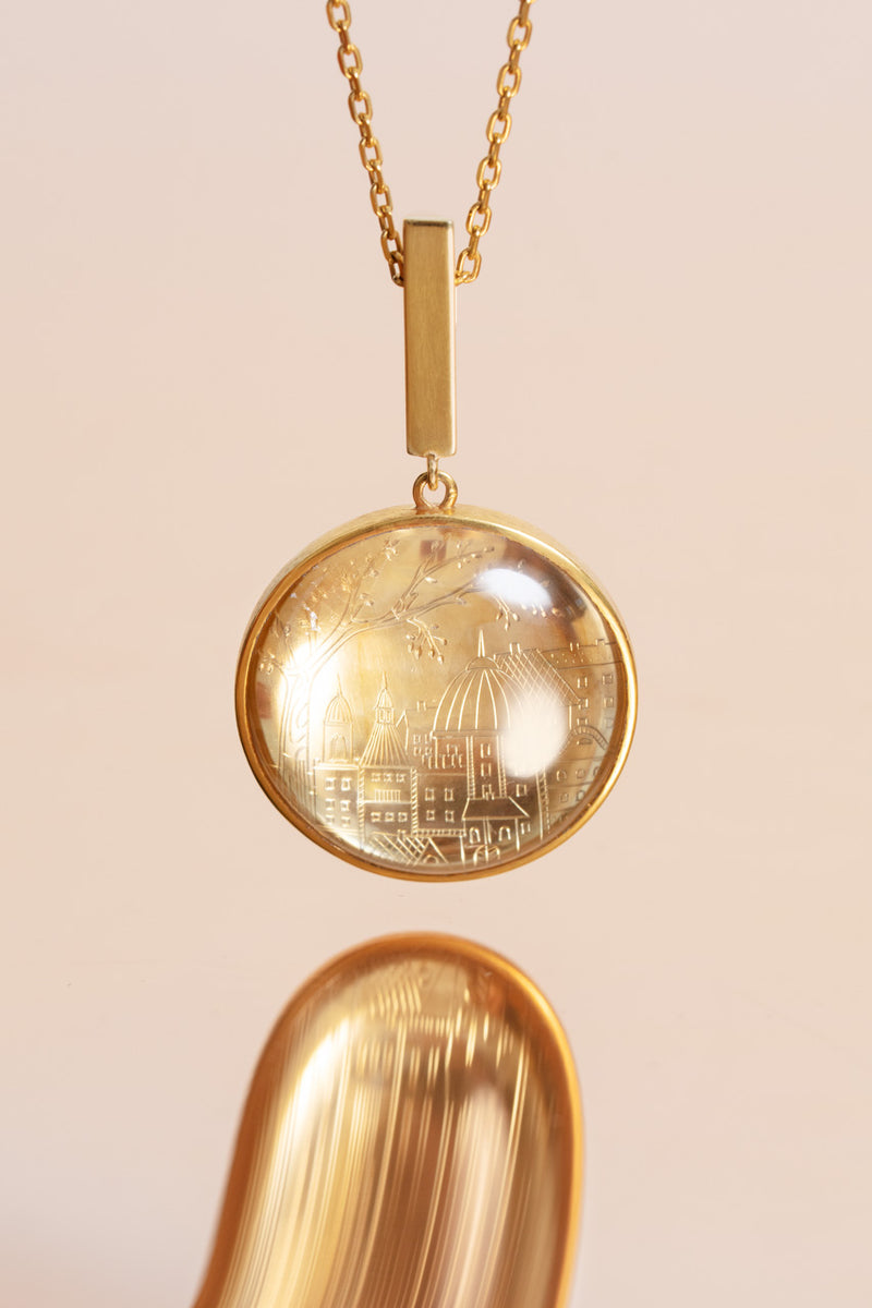Dreamy gold-plated sterling silver pendant with a transparent natural crystal
