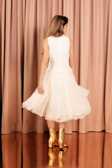 Creamy white midi princess dress with a full tulle skirt lined in pure silk for an irresistible volume and comfort.